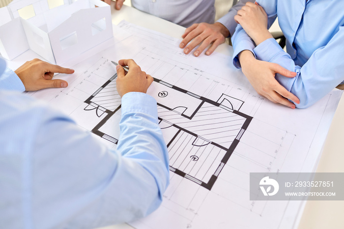 architecture, construction business and people concept - close up of architects discussing blueprint of house project at office