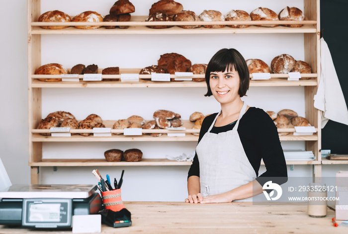 Local business owner or bakery worker behind the counter