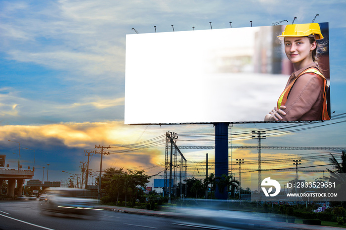 confident Caucasian woman engineer wearing yellow safety helmet advertise on billboard blank for outdoor advertising poster