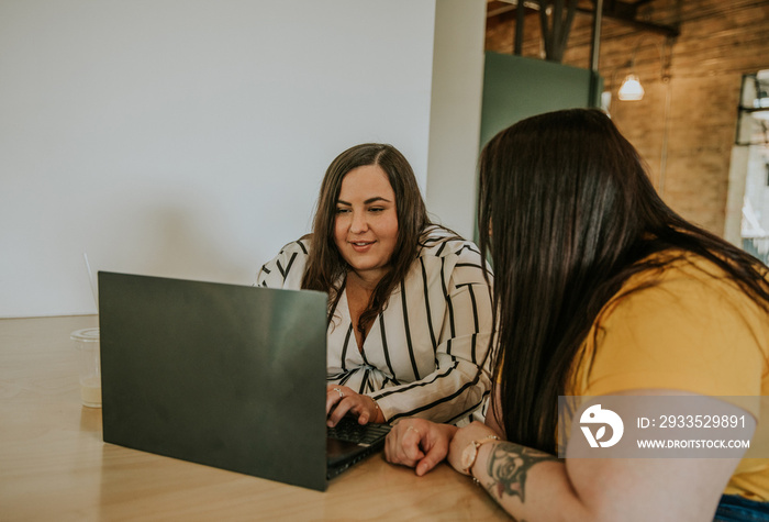 closeup of plus size women working on laptop