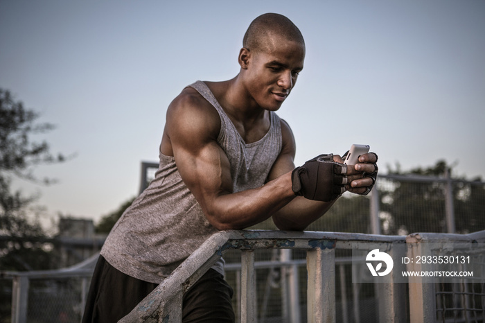 Athlete man using phone