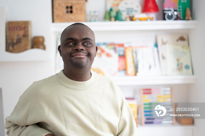 Smiling man with Down syndrome