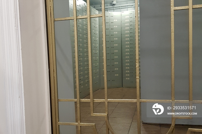 Storage with private deposit grey boxes in the bank by the bars