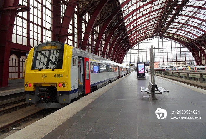 Passenger train in Antwerp Central station, Belgium. Train in Antwerp Central station with an empty platform.