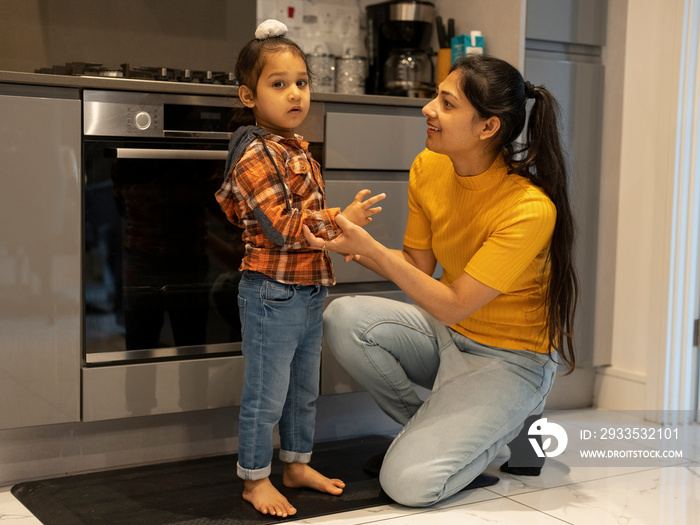 Mother with son (2-3) in kitchen