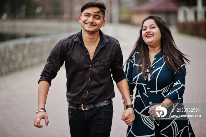 Love story of indian couple posed outdoor.