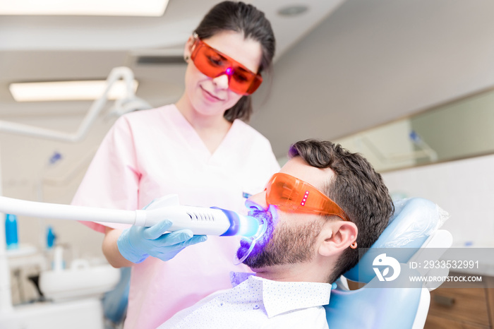 Patient Receiving Dental Treatment From Dentist