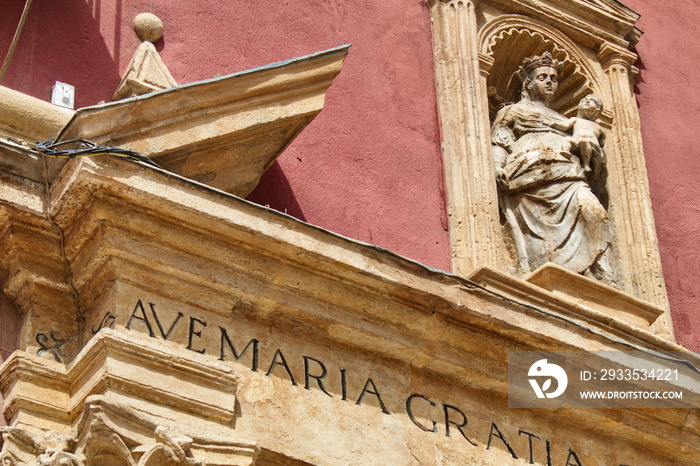 Facade of the Chapel of the Rosary with capitals and pediment in Murcia with the Latin inscription  Ave Maria Gratia Plena