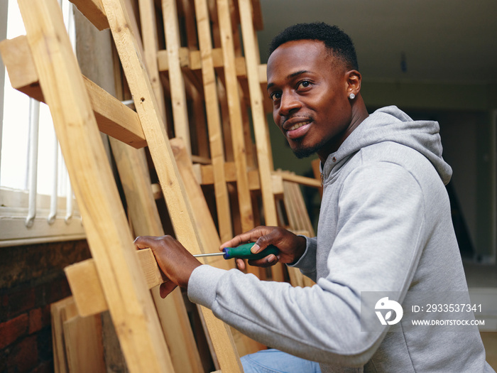 Carpenter using screwdriver