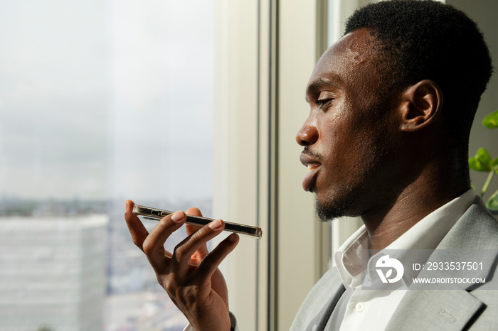 Young businessman using smart phone