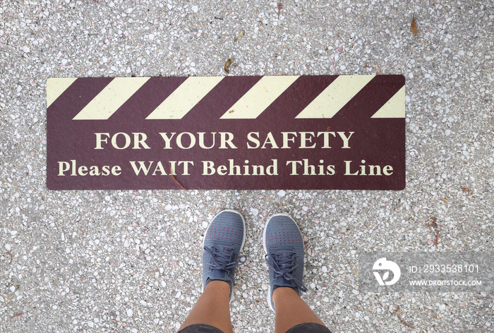 caution floor sign to social distance for your safety stock photo royalty free