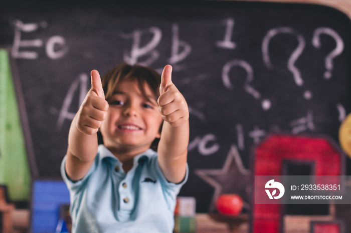 back to school kid pre k child in front of board chalk chalkboard a b c