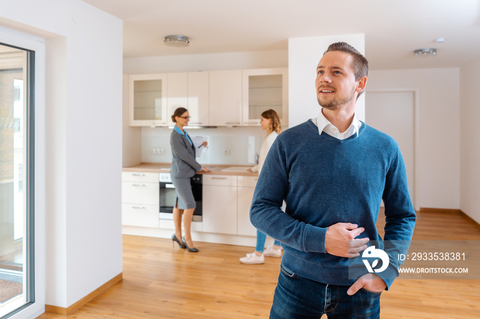 Man being satisfied with the new apartment he wants to buy