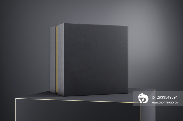 Black gift box with golden line on podium.