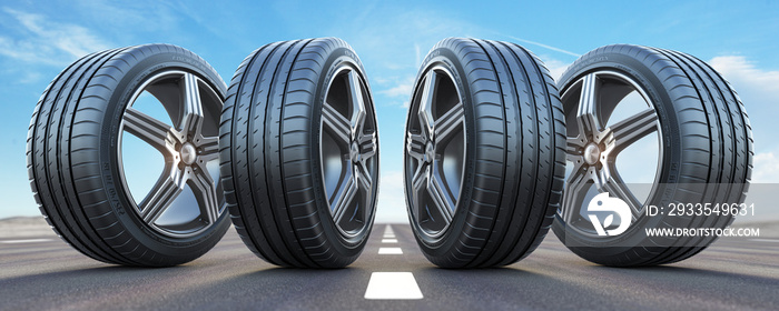 Four car wheel oln the highway with sky background.  Change a tires.