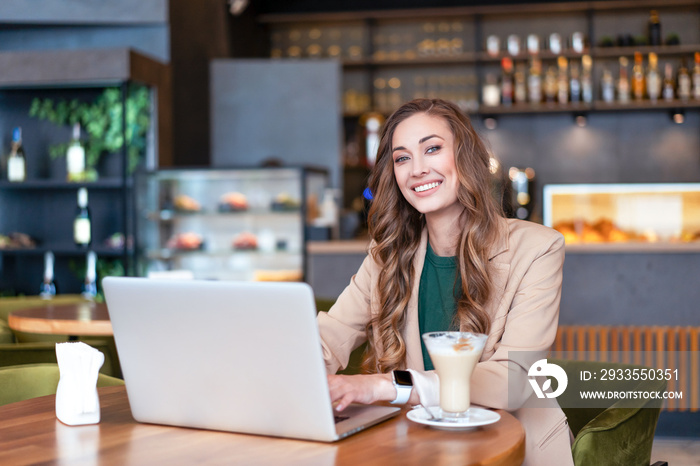 Business Woman Restaurant Owner Use Laptop In Hands Dressed Elegant Pantsuit Sitting Table In Restaurant With Bar Counter Background