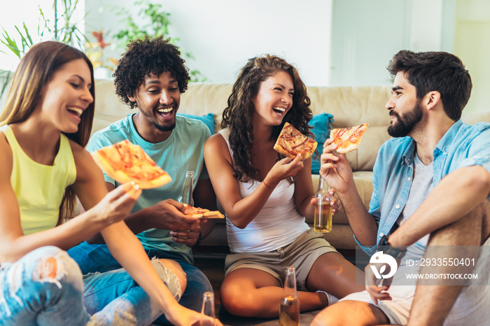 Group of young friends eating pizza.Home party.