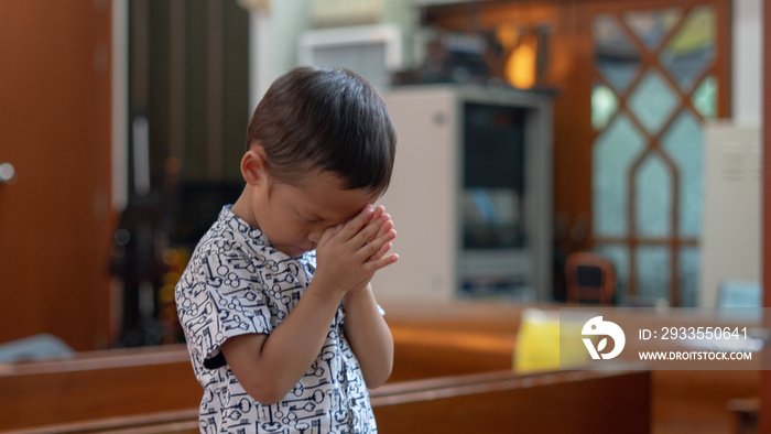 Little Christian Asian Boy Praying to God In worship room at church with Hope and Faith