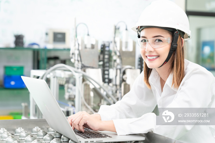 Young woman engineer working on robotics project,