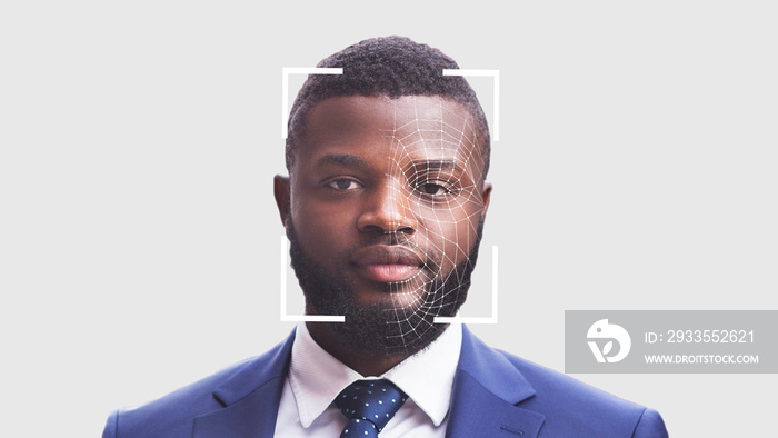 Portrait of young black businessman on white, having face recognition