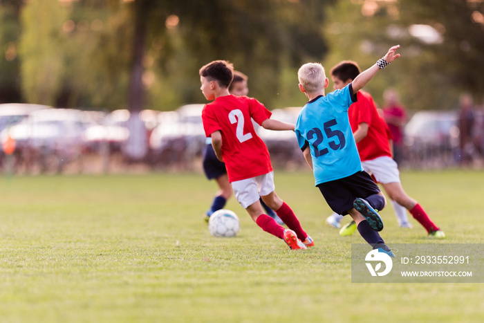 Young children players football match on soccer field