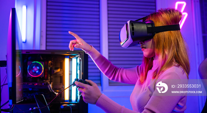 Excited woman playing watching video life simulation at home, Gamer in VR headset glasses exploring metaverse plays online video game touching something on air with neon lights, E-Sport metaverse