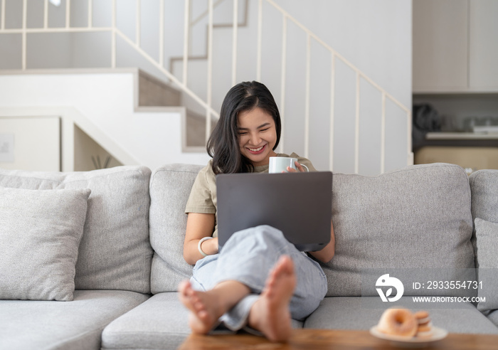 Happy young asian woman having conversation chatting while using laptop at house. Work at home, Video conference, Online meeting video call, Virtual meetings, Remote learning and E-learning