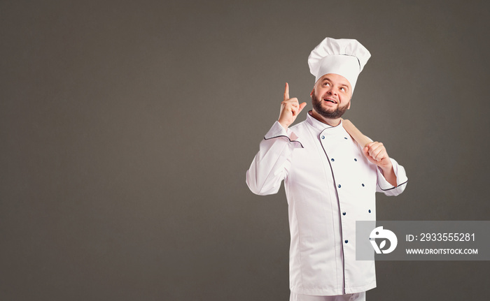 Funny cheerful chef in white uniform on a background.