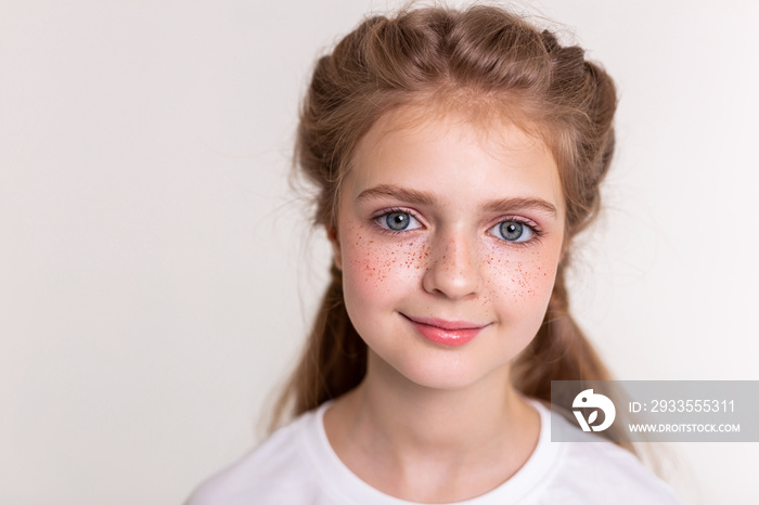 Pretty flawless little child having bright freckles