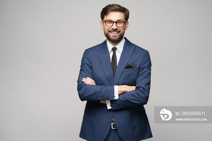 studio photo of young handsome businessman wearing suit