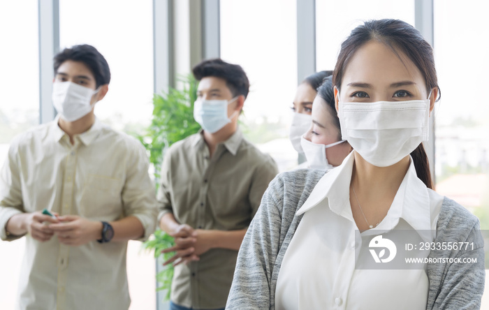 Group of asian business people meeting and working in office and wear mask for protect  prevent infection corona virus covid 19.