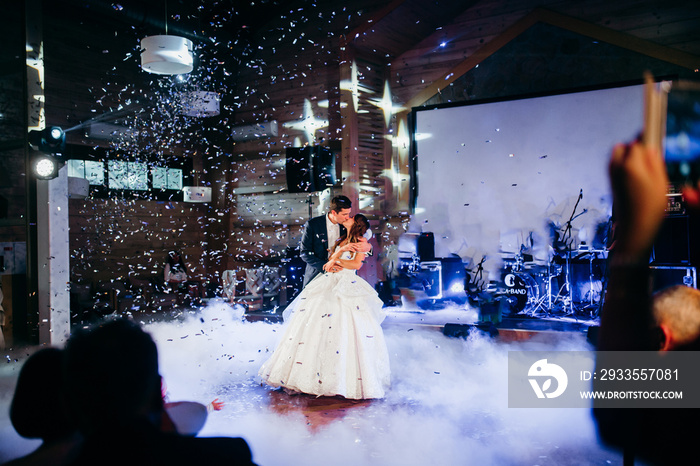 Wedding dance of happy couple in the restaurant