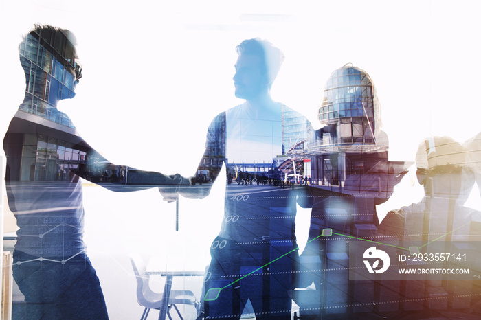 Silhouette of young workers shaking hands in the office. concept of teamwork and partnership. double exposure