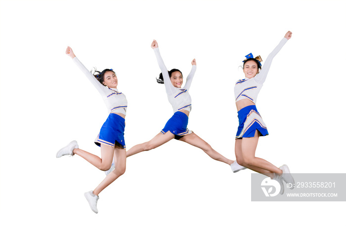 Group of cheerleader girls jumping together on studio