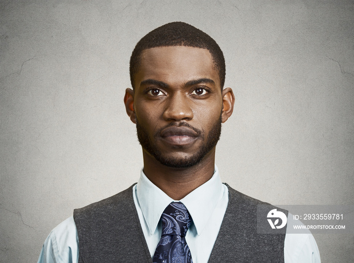 Headshot young business man on grey wall background