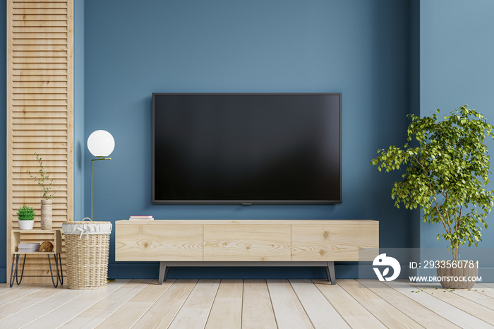 Mockup a TV wall mounted on cabinet in a living room room with dark blue wall.