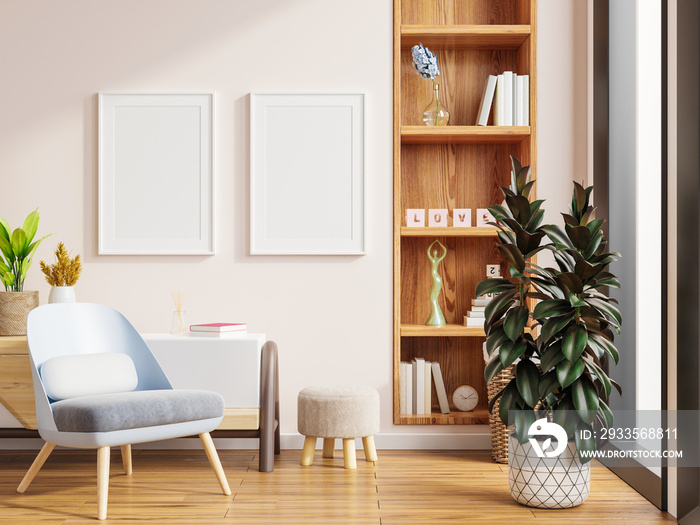 Two poster mockup with vertical frames on empty white wall in living room interior and armchair.