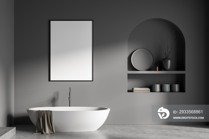 Modern bathroom interior with white ceramic bathtub. Gray walls, concrete flooring. Blank framed poster on wall. Mockup. 3d rendering.