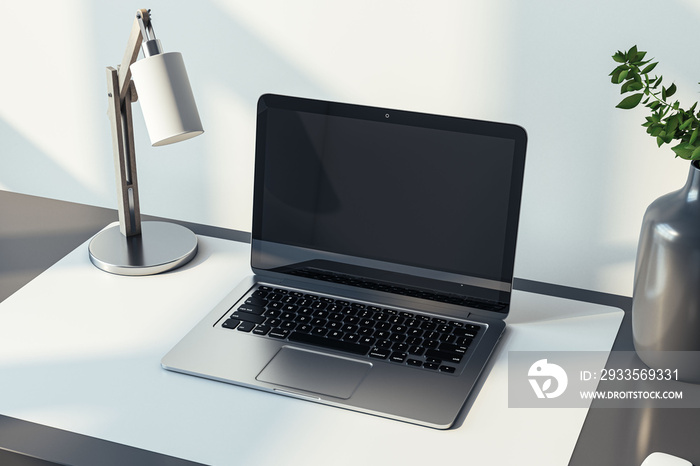 Closeup side view of a home black desk with blank screen modern laptop, lamp and homeplant on light wall background in sunny cozy interior, mockup. Home office and workplace concept. 3D Rendering