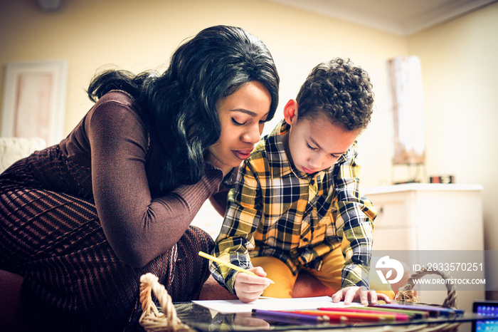 African American woman with her son playing.