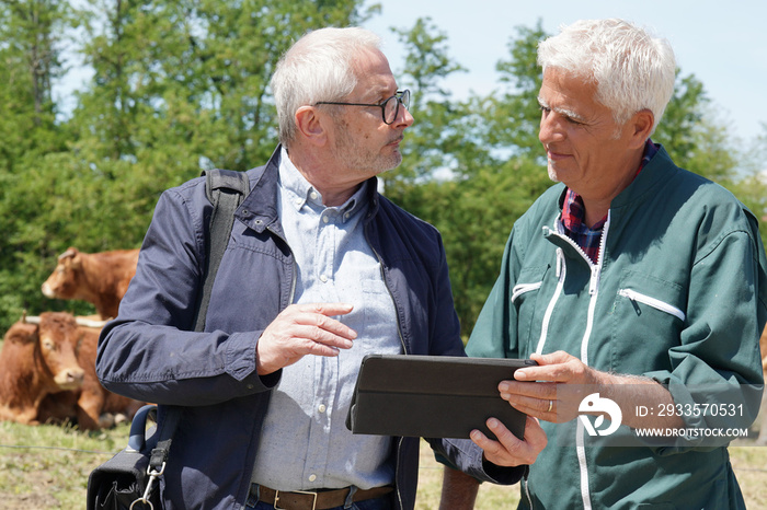 Farmer meeting with financial counseller in farm