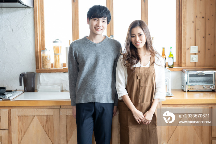 young asian couple in kitchen