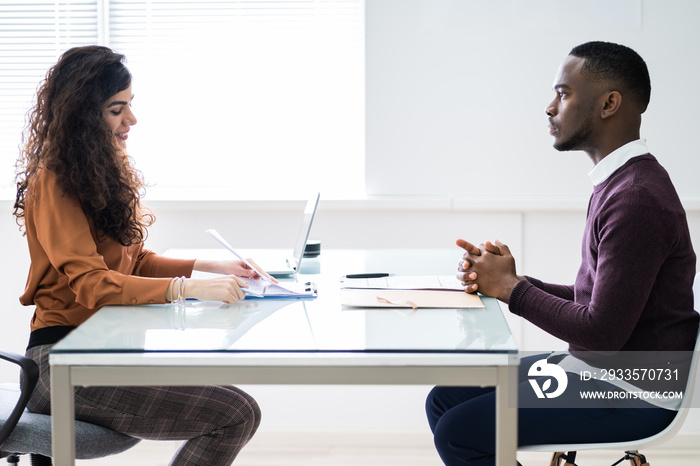 Female Manager Interviewing A Male Applicant