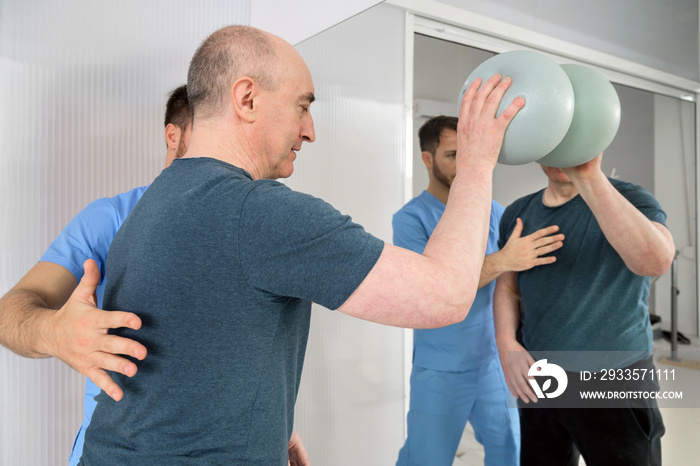 Group of People with disability exercising at rehabilitation clinic. High quality photo