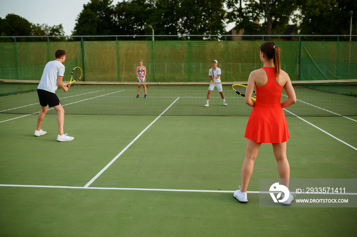 Mixed doubles tennis players, outdoor court