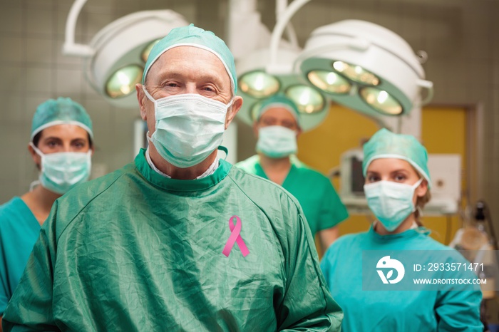 Composite image of smiling surgeon posing with a team