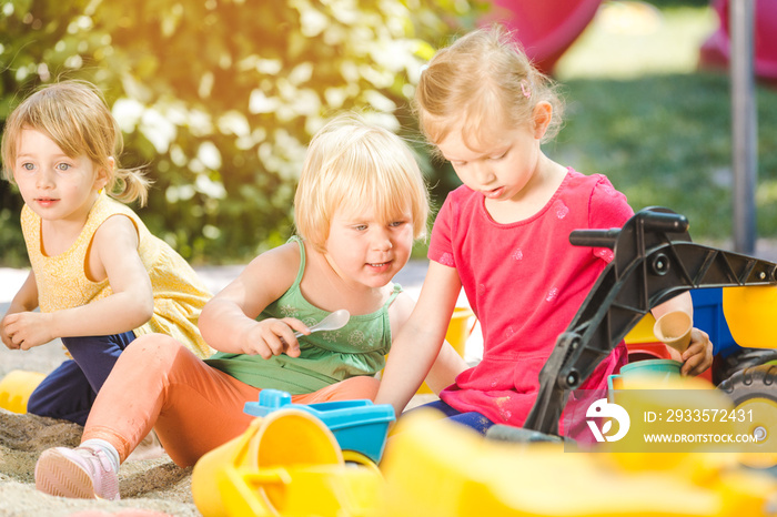 Tree children enjoying the sand box