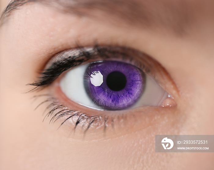 Young woman with beautiful purple eyes, closeup