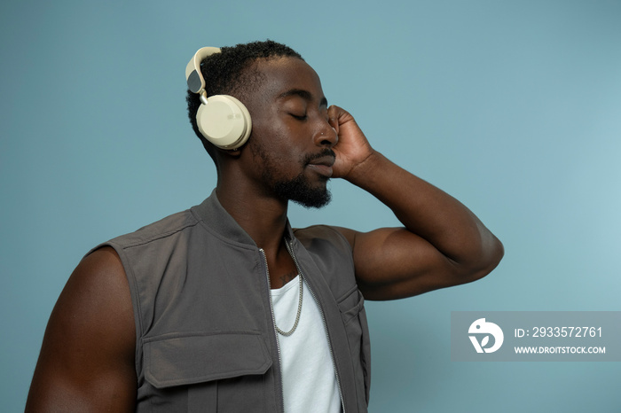 Man with closed eyes, listening to music