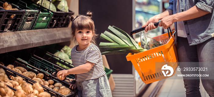 Mom and daughter are shopping at the supermarket